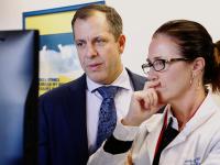 doctors looking at computer together
